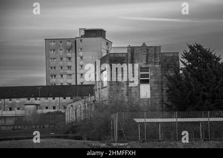 Mainway, Lancaster, United Kingdom. 9th Feb, 2022. The acquisition of the empty Skerton High Scool which sits adjacent to the Mainway estate is seen as a key element of the re-development of the 1960 estate. The city council cabinet have also approved the accelerated Phase 1 which will see the modernisation of Lune and Derby Houses flats School in front of low rise and high rise flats from the 1960s Credit: PN News/Alamy Live News Stock Photo