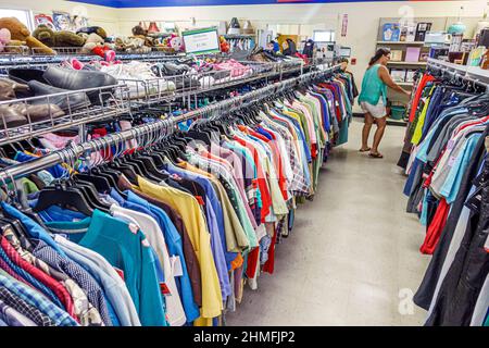 Florida Ellenton,Goodwill Industries,nonprofit thrift shop shoes rack,display sale used clothing woman shopping shopper store inside interior aisle Stock Photo