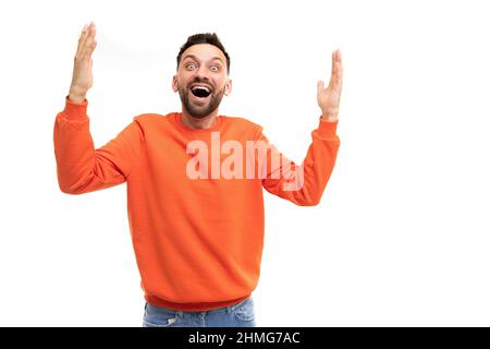 joyful happy man emotionally waving his hands gesturing with open mouth and smile. Stock Photo
