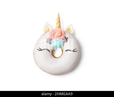 Unicorn donut isolated on white background. Trendy donut unicorn with white glaze. Top view or flat lay Stock Photo