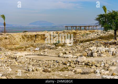 View of ancient archaeological ruins, landscape, and Mount Tabor, in Tel Megiddo National Park, Northern Israel Stock Photo