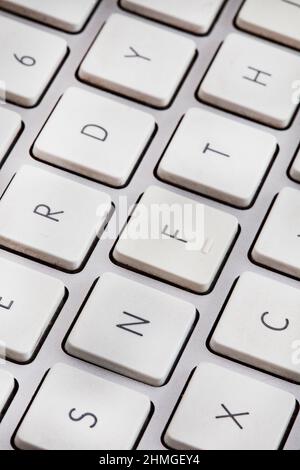 Non-fungible token or NFT concept, NFT spelled out on computer keyboard Stock Photo