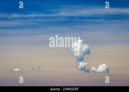 Blue sky with clouds at a sunny day. Stock Photo