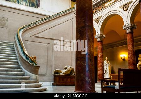 Sweeping marble stairway and replica Italian and Greek statues in the main hall entrance to the Maryland Institute of Art in Baltimore.