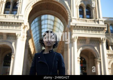 Beautiful young Asian female visiting Milan and enjoying the sights in the city Stock Photo