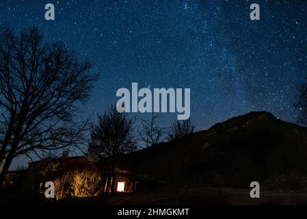 Little house at the night with the starry sky Stock Photo - Alamy