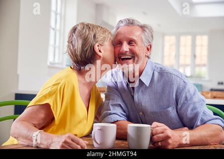 Retired Couple Sitting Outdoors At Home Having Morning Coffee Together  Stock Photo - Download Image Now - iStock