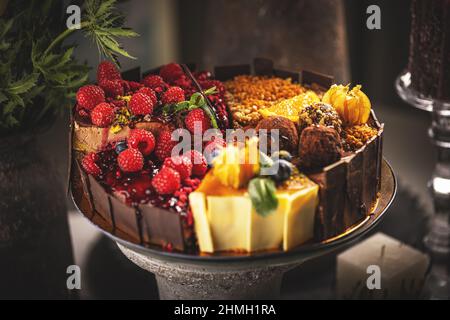 Different slices of various cakes, making a single whole torte Stock Photo