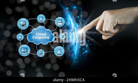 Cloud Computing Concept - Connecting to the Cloud Businessman or Information Technologist Click on the cloud computing icon. Stock Photo