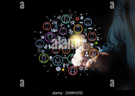 Businessman pressing modern social buttons on a virtual background Stock Photo