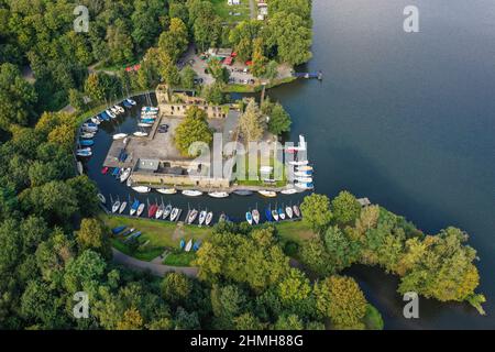 Essen, Ruhr area, North Rhine-Westphalia, Germany - Haus Scheppen on Lake Baldeney. The Scheppen house is a former, aristocratic lean-to of Werden Abbey in the Fischlaken district of Essen, today the forecourt is used as a biker meeting place and the moat is used as a jetty. Stock Photo