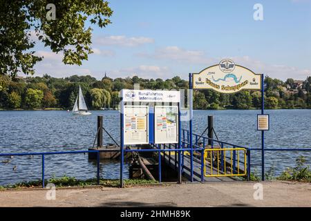 Essen, Ruhr area, North Rhine-Westphalia, Germany - Haus Scheppen jetty at Lake Baldeney. The Scheppen house is a former, aristocratic lean-to of the Werden Abbey in the Fischlaken district of Essen, today the forecourt is used as a biker meeting place and as a landing stage for the excursion boats of the White Fleet. Stock Photo