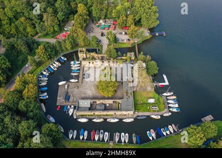 Essen, Ruhr area, North Rhine-Westphalia, Germany - Haus Scheppen on Lake Baldeney. The Scheppen house is a former, aristocratic lean-to of Werden Abbey in the Fischlaken district of Essen, today the forecourt is used as a biker meeting place and the moat is used as a jetty. Stock Photo