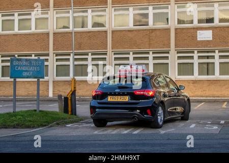 DVSA Driving Test Candidates Only sign,  2019 black Ford Focus 6 speed manual car learner drivers taking their proficiency test in Southport, Merseyside, UK Stock Photo