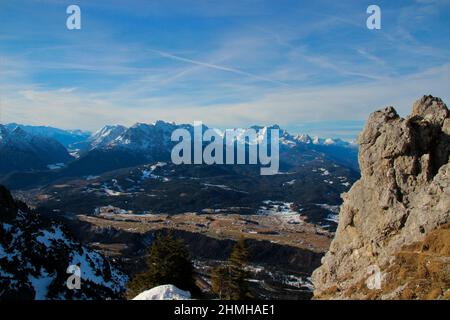 Winter hike to Signalkopf (1895m) near Krün, Wallgau, blue sky, view towards Buckelwiesen, Kranzberg, Arnspitze, Wetterstein Mountains, Zugspitze in the background Stock Photo