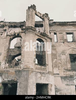Ruins of an ancient house in Odessa, Ukraine. Historic building destroyed by vandals of the proletariat during revolution in 20th century. Vintage eff Stock Photo