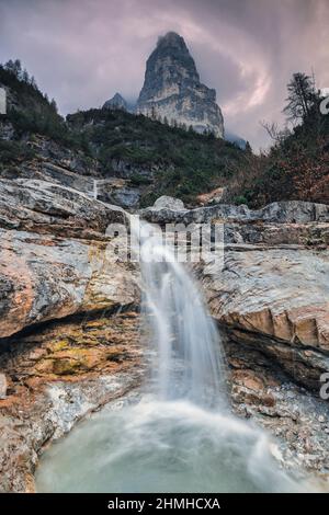 Europe, Italy, Veneto, province of Belluno, Taibon Agordino,  small waterfall in corpassa valley dominated by the trieste tower, civetta group, dolomites Stock Photo