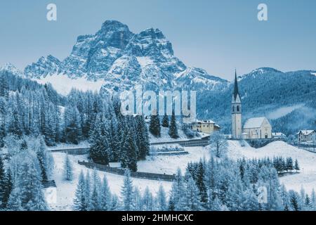 Italy, Veneto, Belluno, the village of Selva di Carore in winter with the mount Pelmo in the background, Dolomites Stock Photo