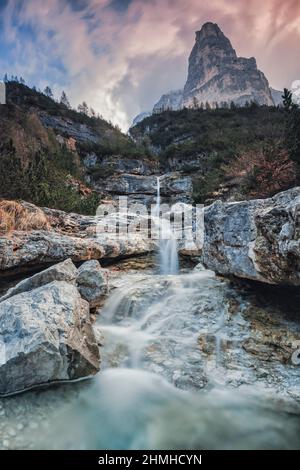 Europe, Italy, Veneto, province of Belluno, Taibon Agordino,  small waterfall in corpassa valley dominated by the trieste tower, civetta group, dolomites Stock Photo