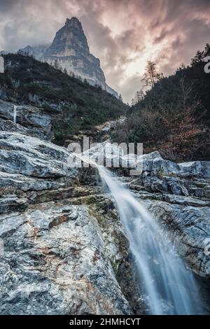 Europe, Italy, Veneto, province of Belluno, Taibon Agordino,  small waterfall in corpassa valley dominated by the trieste tower, civetta group, dolomites Stock Photo