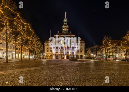 The historic town hall in Lüneburg, which is illuminated in December Stock Photo