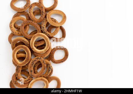 frame of bagel with poppy seeds isolated on white background, empty space for text, top view, food bakery concept Stock Photo