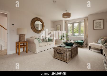 Newport, Essex - March 21 2019: Luxury modern living room in brand new staged home with chic furniture. Stock Photo