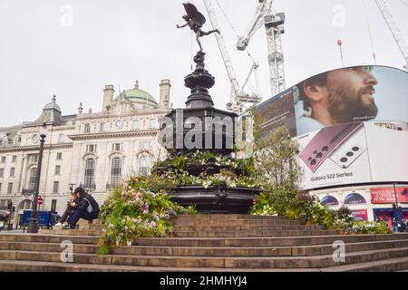 London, England, UK. 10th Feb, 2022. The Shaftesbury Memorial Fountain in Piccadilly Circus, popularly known as Eros, has been covered with plants and flowers ahead of the launch of BBC's Green Planet AR Experience, which opens on February 11th. (Credit Image: © Vuk Valcic/ZUMA Press Wire) Stock Photo