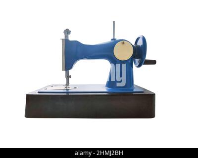 Old retro sewing machine for kids isolated on white background. Stock Photo