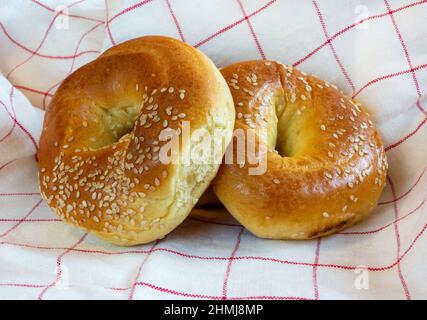 Sesame rolls on kitchen towel background Stock Photo