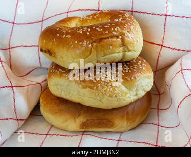 Sesame rolls on kitchen towel background Stock Photo
