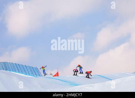 Zhangjiakou, China's Hebei Province. 10th Feb, 2022. Athletes compete during the men's snowboard cross semifinals at Genting Snow Park in Zhangjiakou, north China's Hebei Province, Feb. 10, 2022. Credit: Xu Chang/Xinhua/Alamy Live News Stock Photo