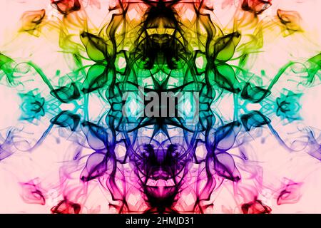 Abstract  smoke swirls in rainbow colors, red, orange, green, yellow, blue, pink and purple, against a pink background