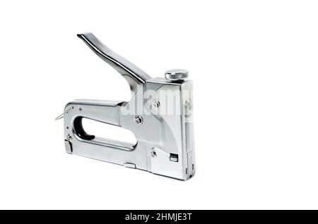 Metal Nickel plated stapler gun on white background, isolate close up. Stock Photo