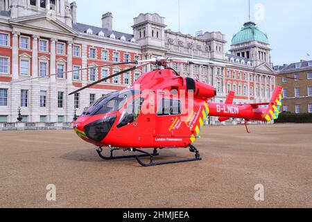 The London Air Ambulance helicopter visits Horse Guards Parade, London, England, United Kingdom, British Isles, on 10th February, 2022. London's Air Ambulance Charity is a registered charity which operates a helicopter emergency medical service (HEMS)  to respond to serious emergencies in and around London. Horse Guards Parade, off Whitehall, is a ceremonial parade ground and is the scene of Trooping the Colour on the Queen's official birthday in June. Stock Photo