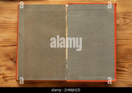 An old unfolded, tattered and yellowed book with blank pages. Stock Photo