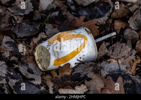 Dirty McDonald cup that was discarded out in the forest Stock Photo
