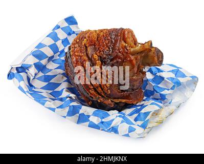 crispy roasted pork knuckle on bavarian warming grill bag isolated on white background Stock Photo