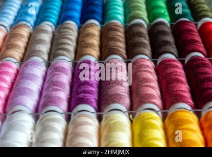 Sewing thread rolls in different colors Stock Photo