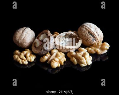 Walnuts on black reflective background Stock Photo