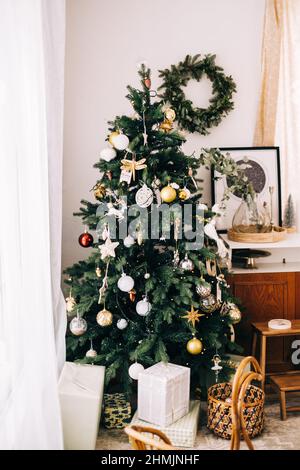 Christmas tree in cozy country house. Stock Photo