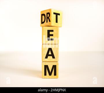Dream team dreamteam symbol. Turned a wooden cube and changed the word Dream to Team. Beautiful white table white background. Business and dream team Stock Photo