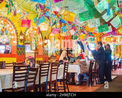 Texas, FEB 2 2022 - People doing musical performance in the El Mercado Snack Bar Stock Photo