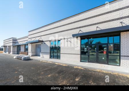 Horizontal wide angle shot of a new commercial shopping center under construction. Stock Photo