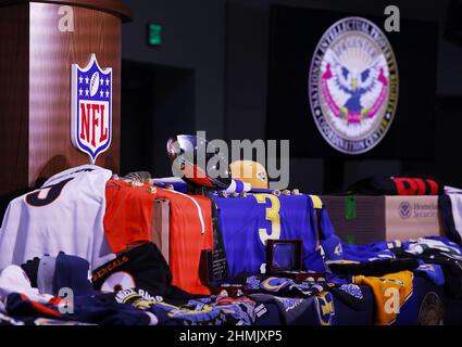 Los Angeles, United States. 10th Feb, 2022. Counterfeit merchandise is displayed on the podium at the Anti Counterfeiting Press Conference for Super Bowl LVI in Los Angeles on Thursday, February 10, 2022. Photo by John Angelillo/UPI Credit: UPI/Alamy Live News Stock Photo