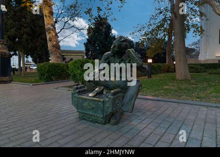 Baku, Azerbaijan - January 03 2022- Shoeshiner statue just near Caspian sea. Stock Photo