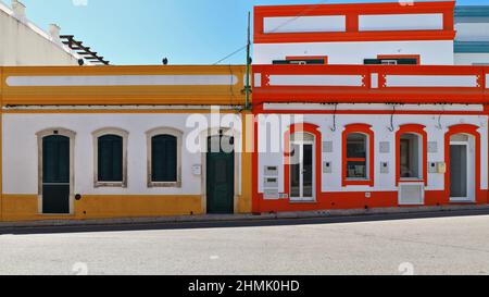 White and yellow-red-blue painted Neoclassical townhouses-Rua Porta Nova Street. Tavira-Portugal-095 Stock Photo
