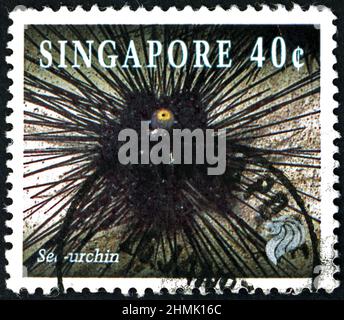 SINGAPORE - CIRCA 1994: a stamp printed in Singapore shows black longpine urchin, diadema setosum, sea urchin, circa 1994 Stock Photo