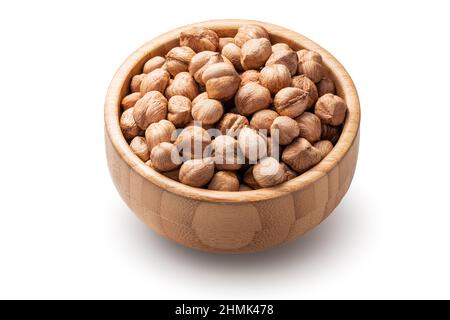 Hazelnuts in wooden bowl on white background. Raw nuts isolated. Stock Photo