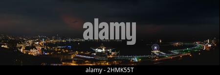 Baku, Azerbaijan - January 03 2022- Panoramic city view with Caspian Sea at night. Stock Photo